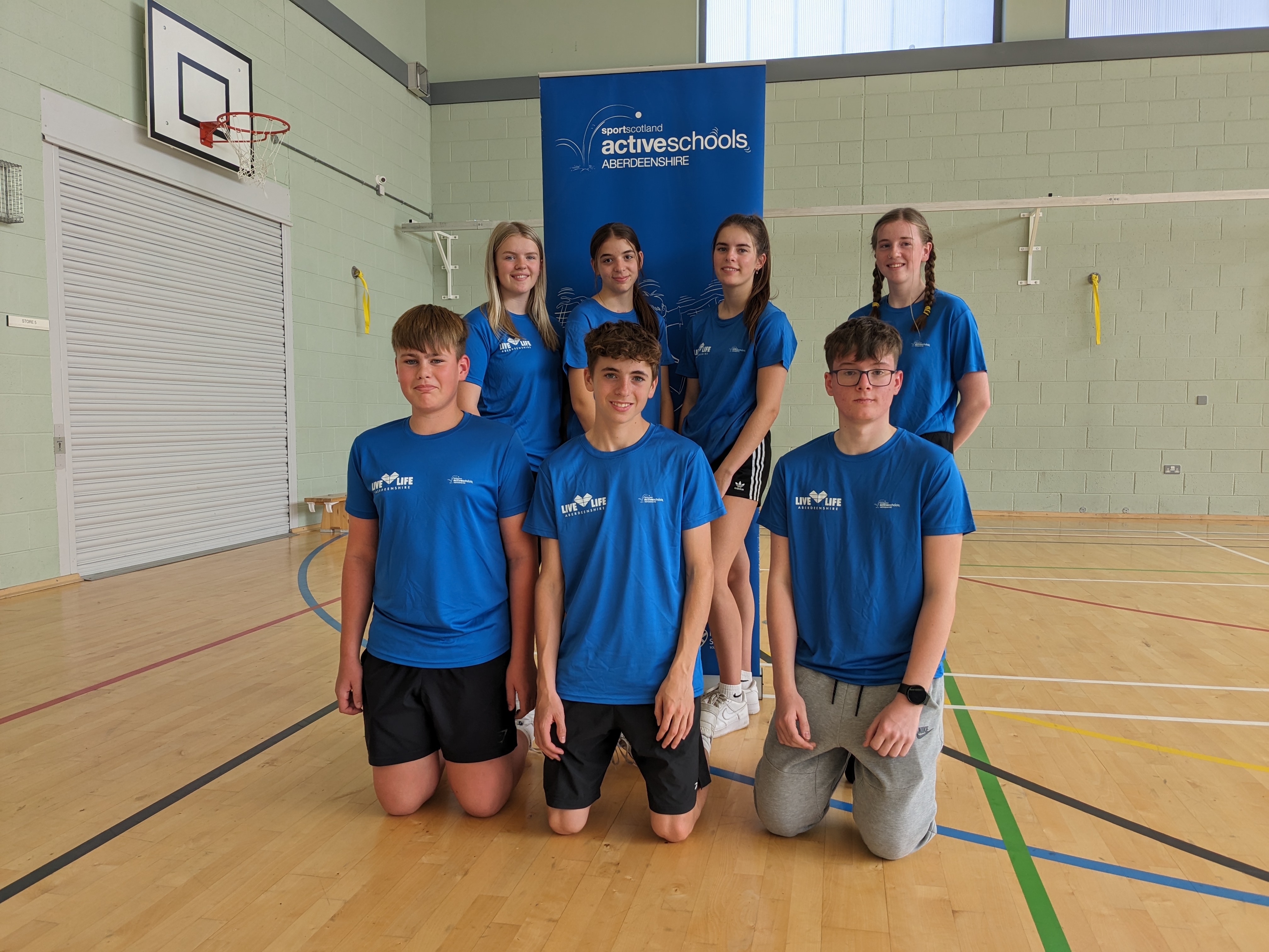 A group of senior pupils swimming lengths in the pool