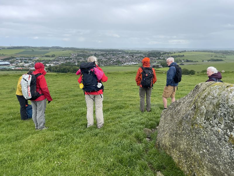 A group of walkers on a hill overlooking Inverurie