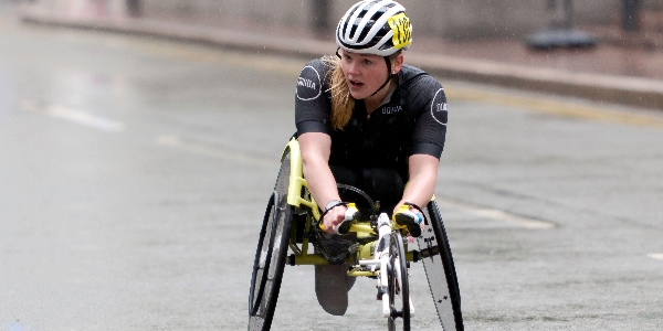 Joanna racing in her wheelchair