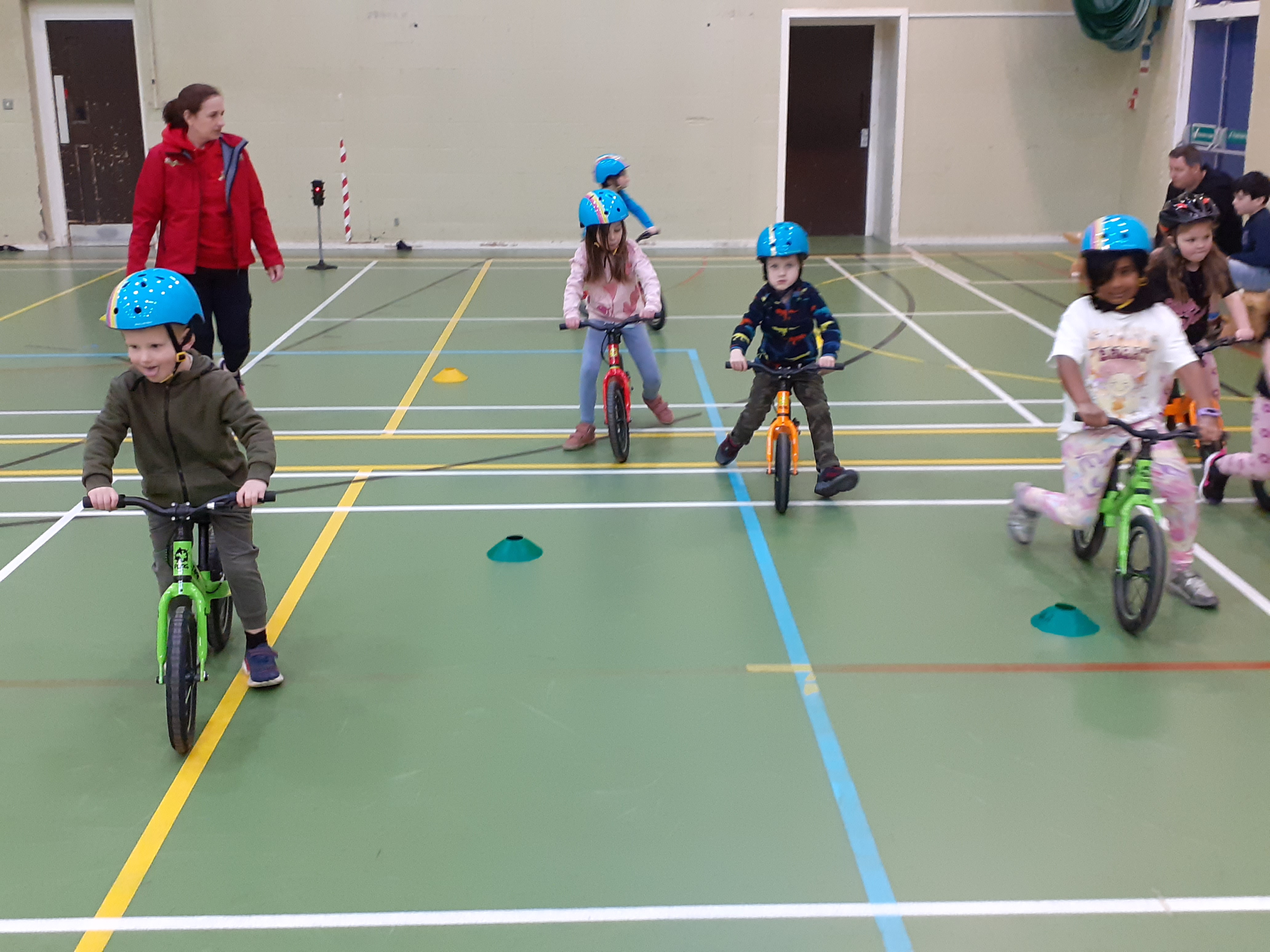 a line up balance bikes in different colours