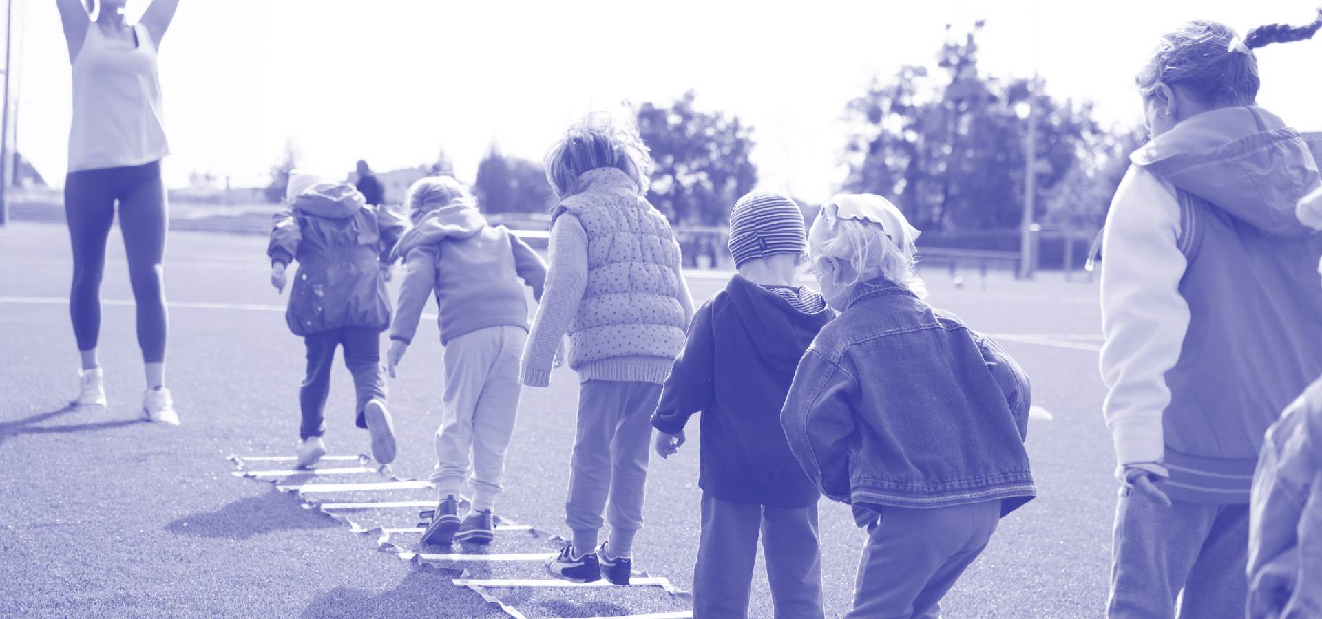 A black and white image of children playing outdoors