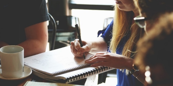 A group of people around a meeting table