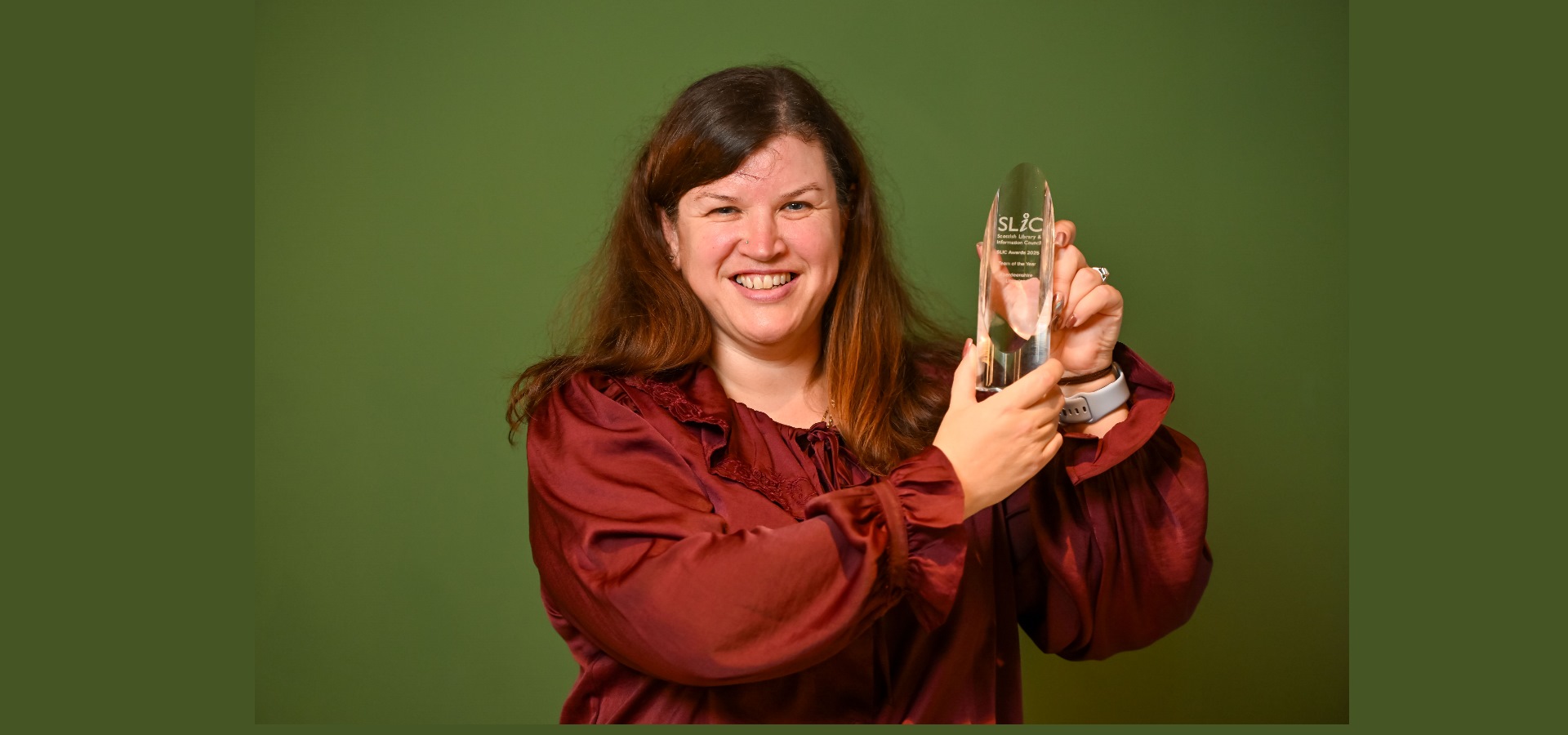 Pearl Morrison collecting the award n behalf of HMP Grampian Prison Library