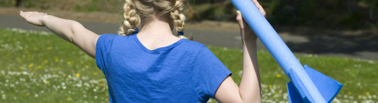 Child throwing a plastic javelin 